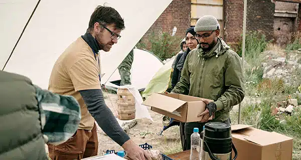 Government workers distributing aid